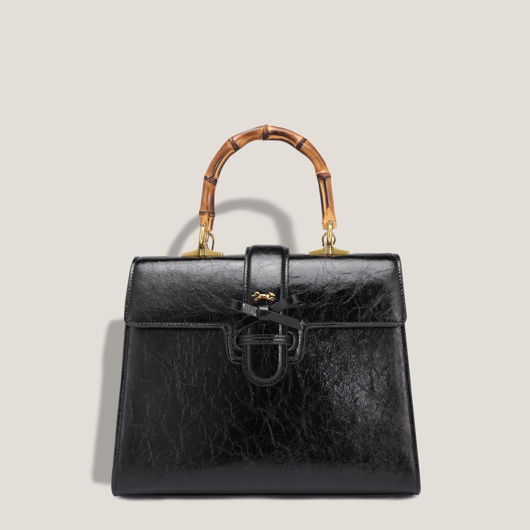 THE CARLTON BOW BAG PETITE - NOIR "CRUSHED PATENT"