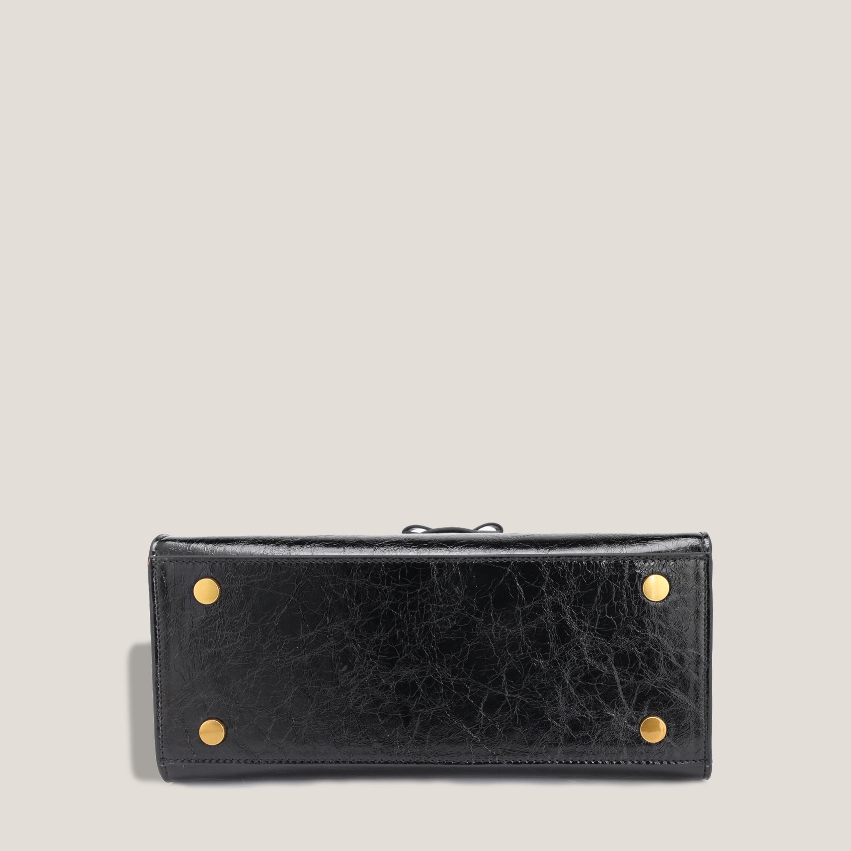 THE CARLTON BOW BAG PETITE - NOIR "CRUSHED PATENT"