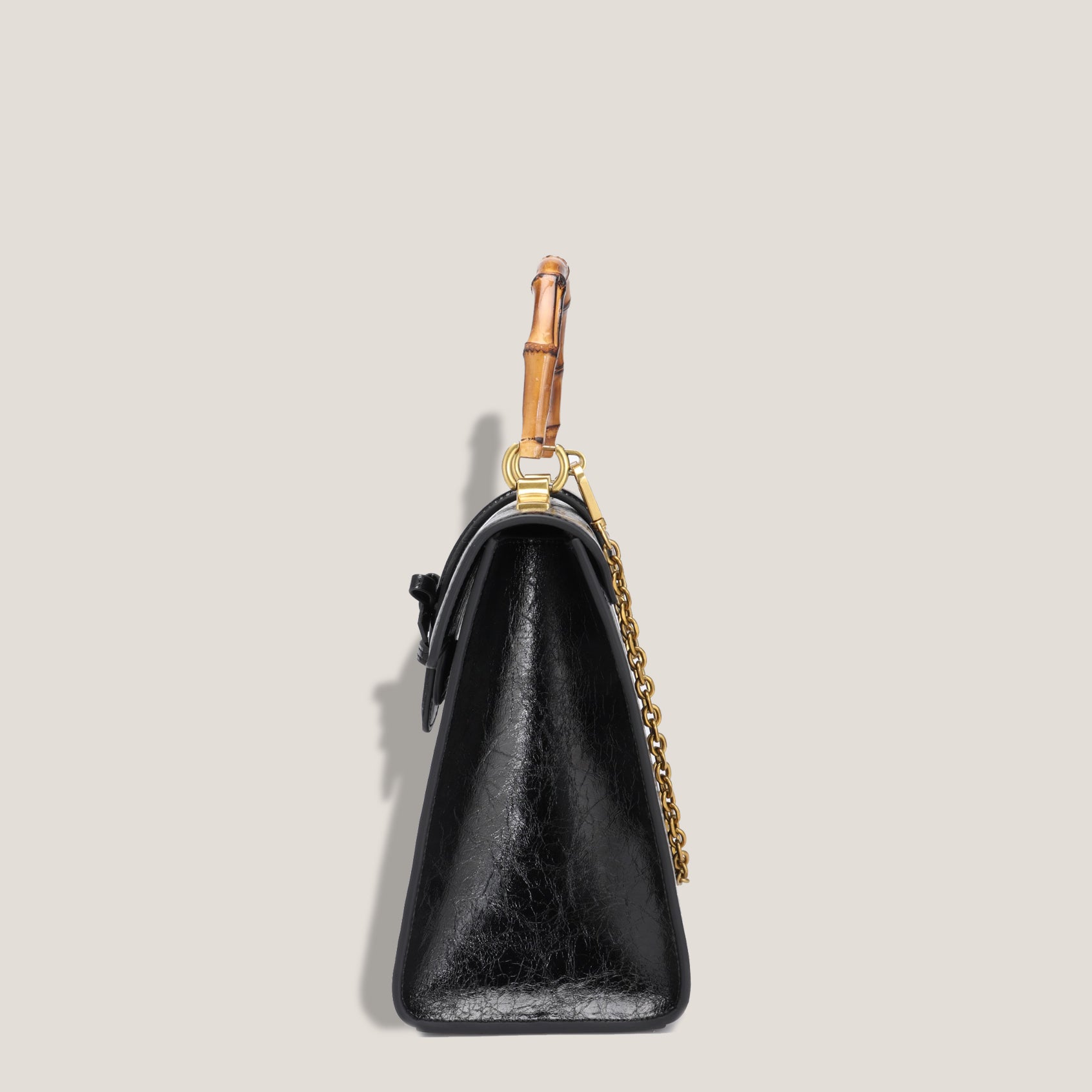 THE CARLTON BOW BAG PETITE - NOIR "CRUSHED PATENT"